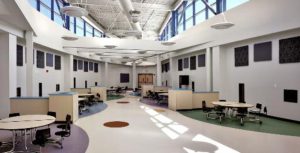 Colored zones and low walls identify class-specific eating areas at the friendship school in Waterford, Conn.