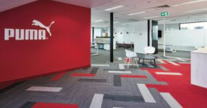 Carpet tile’s ability to interject bold colors help incite lively, healthy workspaces for active brands like Puma. 